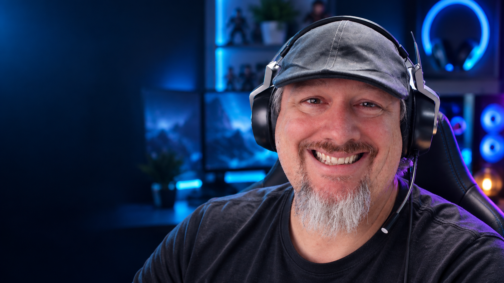 EdPhonez in a blue-lit gaming room wearing his headset